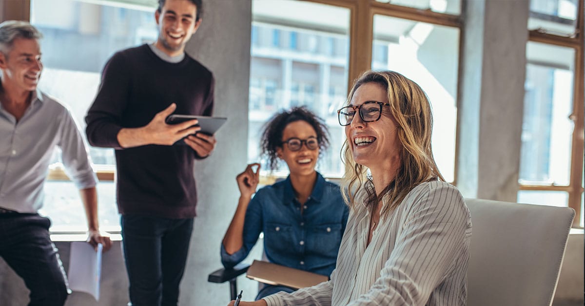 a group of people standing in front of a window