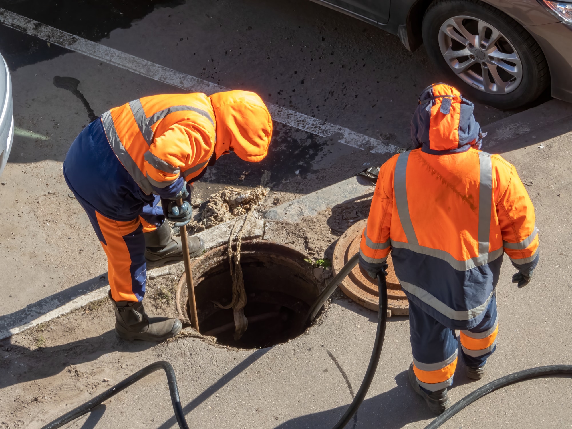 PowerVac team members performing a sewer line inspection on a commercial property to source sewer problems.
